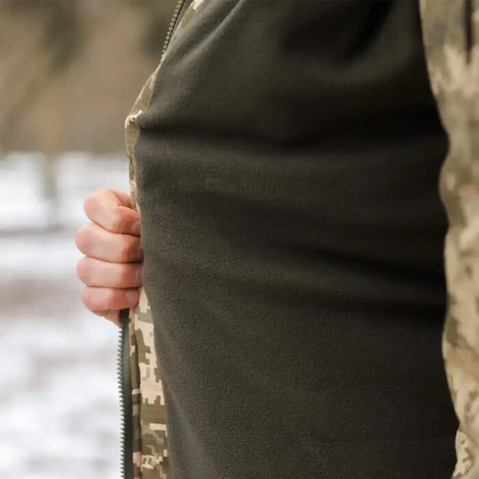 Hand demonstrating the fleece-insulated inner layer of the Ukrainian Army winter coat for extreme cold protection.