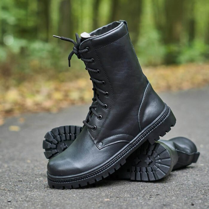 Black tactical winter boots for military use, featuring durable leather and NATO-standard soles. Lined with high-quality fur for superior insulation.