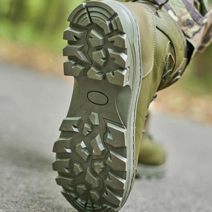 Close-up of the rugged outsole of the olive Temp tactical boots, emphasizing its all-terrain traction.