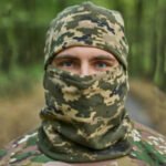 Side view of a pixel camo winter balaclava, a tactical balaclava mask for men used by the Ukrainian army.