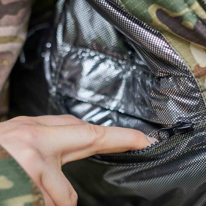 Close-up of the Omni-Heat insulation layer inside a military jacket, designed to retain body heat in extreme cold.