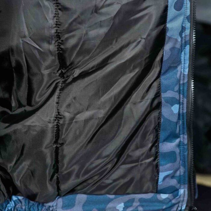 Close-up of the digital blue camouflage winter jacket's insulated inner lining for warmth and comfort.