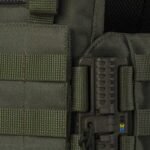 Tactical buckle system close-up on olive side panel