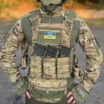 Complete multicam tactical plate vest setup with front pouches and groin protector