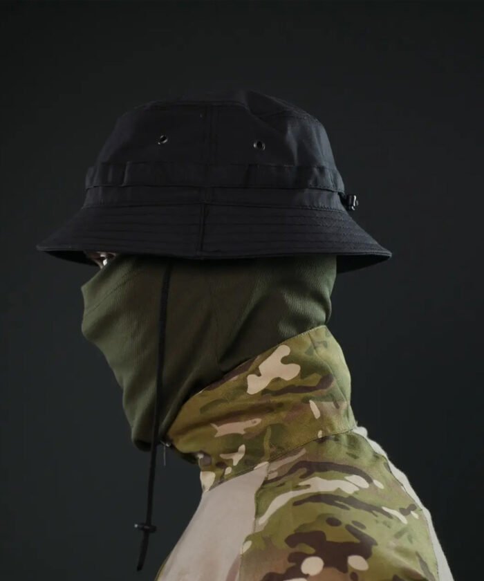Black panama hat worn with military outfit, full side profile