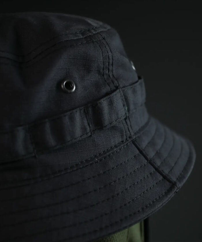 Reinforced stitching and metal eyelets on tactical summer hat for breathability