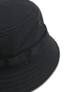 Close-up of ripstop black panama hat with metal ventilation eyelets and rugged stitching