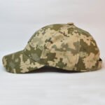 Side angled view of military pixel camo cap with embroidered Ukrainian trident