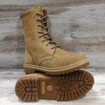 Pair of Ukrainian NATO beige boots, one upright and one showing sole