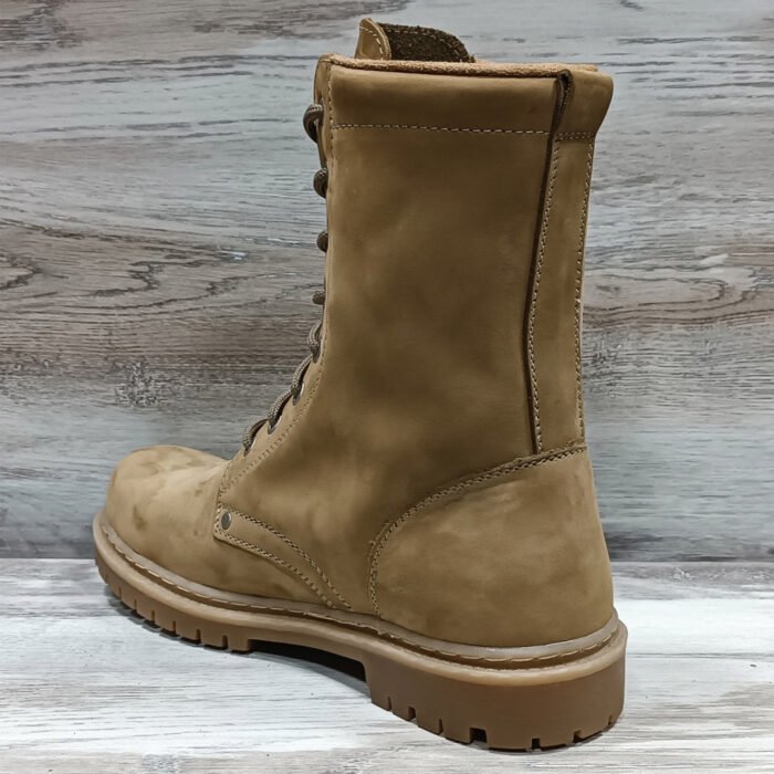 Close-up of stitching and leather texture on NATO beige combat boot
