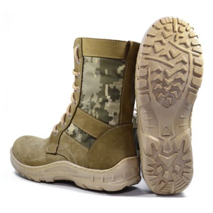 Pair of Ukrainian beige tactical boots with pixel camo inserts, one upright and one showing the sole