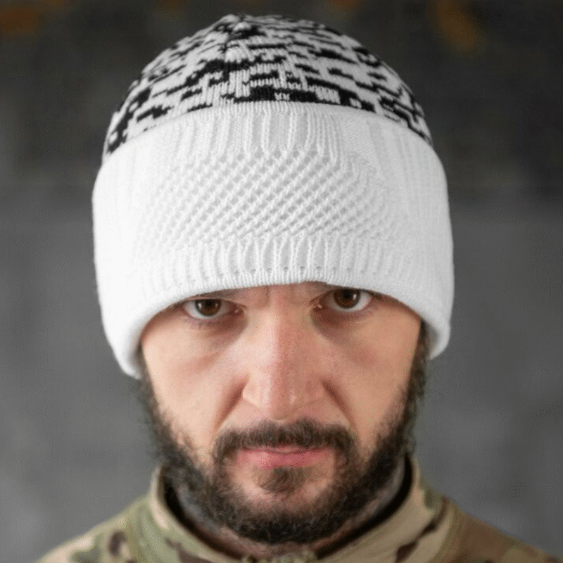 White winter balaclava folded as beanie hat, black camo pattern knitted cap for cold weather tactical use.