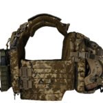 Side profile of pixel tactical vest with attached helmet holder and MOLLE cummerbund